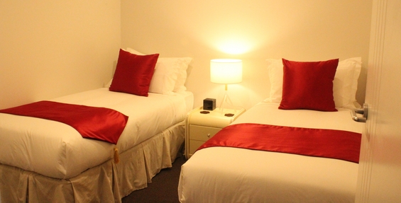 the second room of two-bedroom suite has two single beds